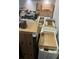 View of a cluttered storage room filled with moving boxes and construction materials at 2518 Sunset Ln, Lutz, FL 33559