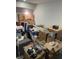 View of a storage room cluttered with unpacked boxes and furniture at 2518 Sunset Ln, Lutz, FL 33559