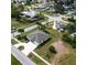 New construction home with gray roof and a long driveway on a large lot at 5479 S Biscayne Dr, North Port, FL 34287