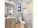 Bathroom features sink, vanity, toilet, and shower at 5479 S Biscayne Dr, North Port, FL 34287