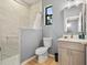 Bright bathroom with a shower and updated vanity at 5479 S Biscayne Dr, North Port, FL 34287