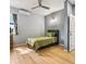 Bedroom features ceiling fan and natural light at 5479 S Biscayne Dr, North Port, FL 34287