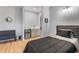 Modern bedroom featuring a kitchenette, sleek furniture, and contemporary lighting at 5479 S Biscayne Dr, North Port, FL 34287