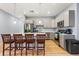 Modern kitchen featuring stainless steel appliances, ample cabinet space, and a center island with bar stools at 5479 S Biscayne Dr, North Port, FL 34287