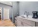 Wet bar with a coffee maker and mini refrigerator in a suite at 5479 S Biscayne Dr, North Port, FL 34287