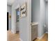 Bright laundry room features modern cabinets and a view into additional rooms at 5479 S Biscayne Dr, North Port, FL 34287