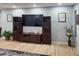 Cozy Gathering room with dark wood entertainment center and ample space for relaxing at 5479 S Biscayne Dr, North Port, FL 34287