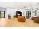 Bright open floor plan featuring a spacious living area with high ceilings and a seamless flow to other rooms at 5479 S Biscayne Dr, North Port, FL 34287