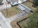 Bird's eye view of a home with a covered porch, driveway, and spacious surroundings at 9202 Teak St, New Port Richey, FL 34654