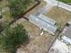 Aerial view of a home with a fenced yard, offering privacy and outdoor space at 9202 Teak St, New Port Richey, FL 34654