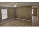 The bedroom offers a neutral palette, tile floors, and a window to let in plenty of natural light at 9202 Teak St, New Port Richey, FL 34654