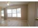 Cozy bedroom with tile floors, large windows that bring in natural light, and a mirrored closet at 9202 Teak St, New Port Richey, FL 34654