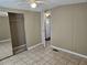 Comfortable bedroom with tile flooring and closet space, offering a relaxing retreat at 9202 Teak St, New Port Richey, FL 34654