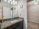 Bathroom with a granite countertop, a vessel sink, and decorative lighting fixtures at 13201 Orca Sound Dr, Riverview, FL 33579