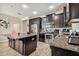 Well-equipped kitchen includes a center island, stainless steel appliances, and granite countertops at 13201 Orca Sound Dr, Riverview, FL 33579