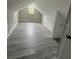 Bright attic space featuring wood laminate flooring, offering a versatile living area at 5117 16Th Ave, Gulfport, FL 33707