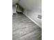 Spacious attic with gray wood laminate flooring, offering a versatile bonus space at 5117 16Th Ave, Gulfport, FL 33707
