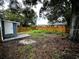 Large backyard with wood fence, offering plenty of space for outdoor activities and privacy at 5117 16Th Ave, Gulfport, FL 33707