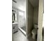Modern bathroom with a tiled shower and updated vanity, offering a clean, sleek look at 5117 16Th Ave, Gulfport, FL 33707