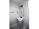 Modern bathroom featuring a sleek vanity, black fixtures, and stylish marble-look tiles at 5117 16Th Ave, Gulfport, FL 33707