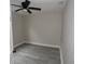 Simple bedroom with modern flooring, ceiling fan, and neutral paint, creating a blank canvas at 5117 16Th Ave, Gulfport, FL 33707