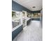 Inviting screened front porch with tile floors, providing a relaxing outdoor space at 5117 16Th Ave, Gulfport, FL 33707