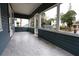 Inviting screened front porch with tile floors, perfect for enjoying the outdoors at 5117 16Th Ave, Gulfport, FL 33707