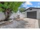 Backyard featuring a grill, outdoor seating, and a detached garage at 4444 5Th S Ave, St Petersburg, FL 33711