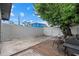 Spacious backyard with a white fence, concrete patio, and a barbecue grill at 4444 5Th S Ave, St Petersburg, FL 33711