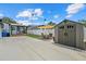 Spacious backyard features a covered patio, storage shed, and privacy fence at 4444 5Th S Ave, St Petersburg, FL 33711
