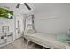 This bedroom offers a ceiling fan, shelf, and a twin sized bed at 4444 5Th S Ave, St Petersburg, FL 33711