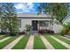 Charming home featuring a well-manicured lawn and inviting front porch at 4444 5Th S Ave, St Petersburg, FL 33711