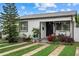 Charming home featuring a well-manicured lawn and inviting front porch at 4444 5Th S Ave, St Petersburg, FL 33711