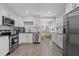 Modern kitchen features granite countertops, stainless steel appliances and white cabinets at 4444 5Th S Ave, St Petersburg, FL 33711