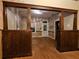 Living room showcasing hardwood floors, exposed walls, and elegant ceiling fixture at 917 E 15Th Ave, Tampa, FL 33605