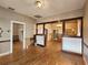 View of the living room showing wood floors, dark-stained columns and doorway at 917 E 15Th Ave, Tampa, FL 33605