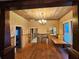 Bright living room with hardwood floors, offering a unique space with original details ready for renovation at 917 E 15Th Ave, Tampa, FL 33605