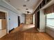 Spacious living room with wood floors, large windows, and vintage design elements at 917 E 15Th Ave, Tampa, FL 33605