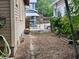 View of a side yard or driveway, showing access to the property with a gate between neighboring homes at 917 E 15Th Ave, Tampa, FL 33605