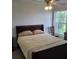 Serene bedroom featuring a comfortable bed, soft lighting, and tranquil views at 4611 Herman Cir, Port Charlotte, FL 33948