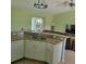 Well-equipped kitchen featuring granite countertops, stainless steel sink, and an open layout at 4611 Herman Cir, Port Charlotte, FL 33948