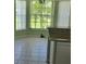 Bright kitchen nook with natural light, tile flooring, and an adjacent kitchen counter at 4611 Herman Cir, Port Charlotte, FL 33948