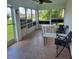 Relaxing lanai with tile flooring, bright light, and views of the private outdoor space at 4611 Herman Cir, Port Charlotte, FL 33948