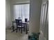 Bright home office space with natural light from a window, desk and tile flooring at 4611 Herman Cir, Port Charlotte, FL 33948