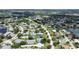 An aerial view showing a home's location within a well-maintained community near a lake and golf course at 6948 W Country Club N Dr, Sarasota, FL 34243