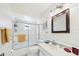Bright bathroom with glass shower doors and a large vanity at 6948 W Country Club N Dr, Sarasota, FL 34243