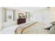 Bright bedroom featuring large windows, neutral walls, and plush carpeting at 6948 W Country Club N Dr, Sarasota, FL 34243