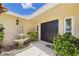 Inviting front entrance with a fountain, lush landscaping, and a well-maintained facade at 6948 W Country Club N Dr, Sarasota, FL 34243