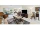 Spacious living area showcasing neutral walls, plush carpeting, and a seamless transition to the outdoor patio at 6948 W Country Club N Dr, Sarasota, FL 34243