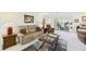 Inviting living room boasts comfortable seating, stylish decor, and seamless access to the outdoor patio area at 6948 W Country Club N Dr, Sarasota, FL 34243